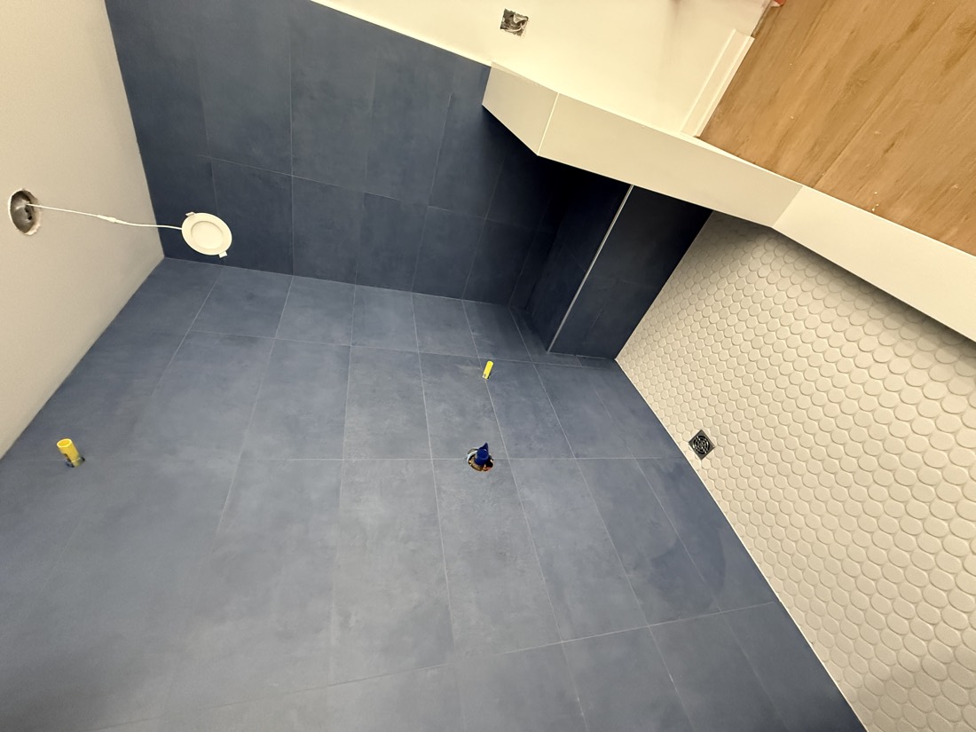 Charcoal shower with a mosaic shower pan