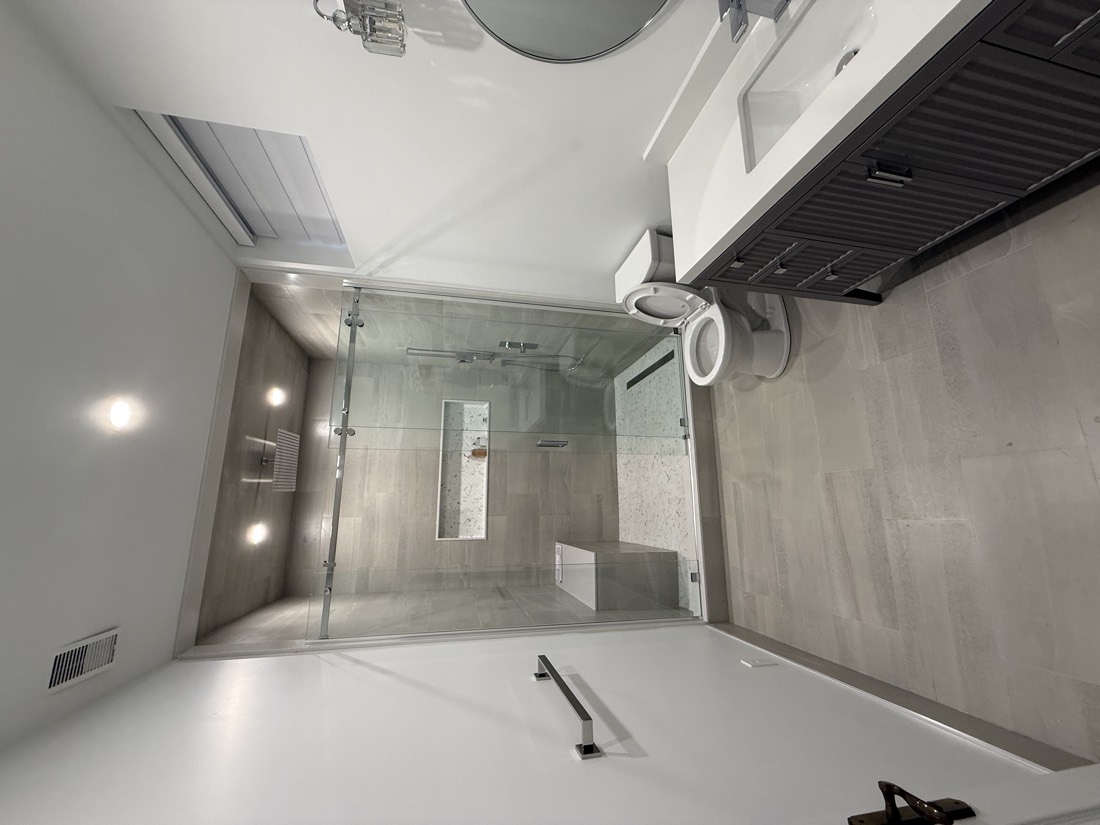 Full porcelain bathroom with vanity and shower